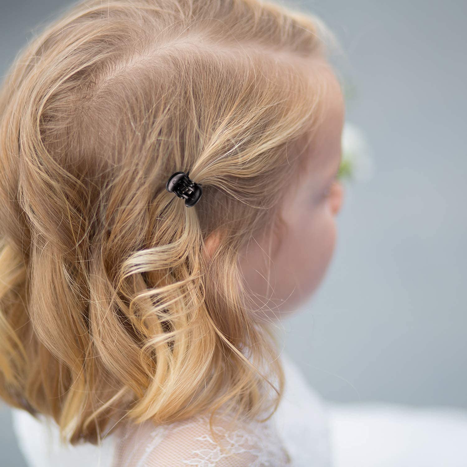 Thirty six piece pack of small plastic hair clips showing three distinct color assortments