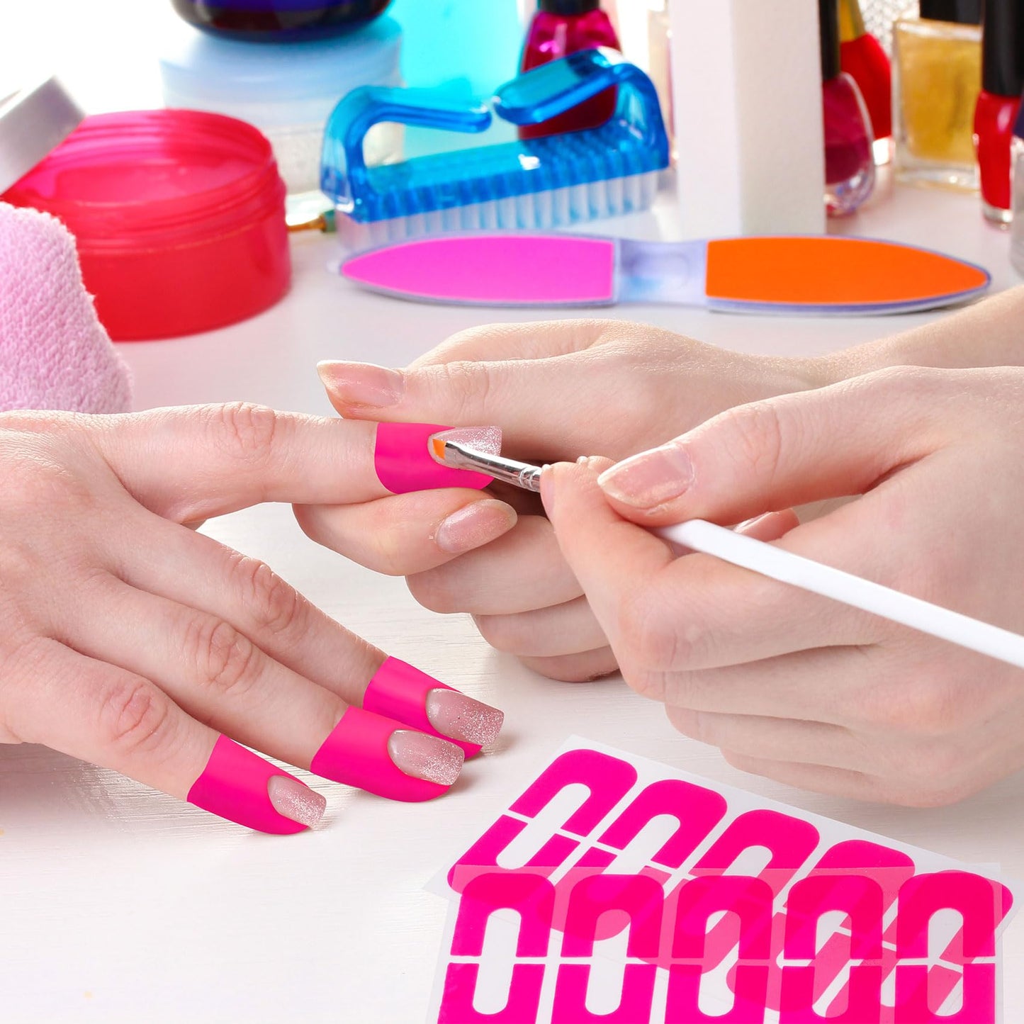 VARMDUKKE pink peelable finger tape being removed to show clean nail edges