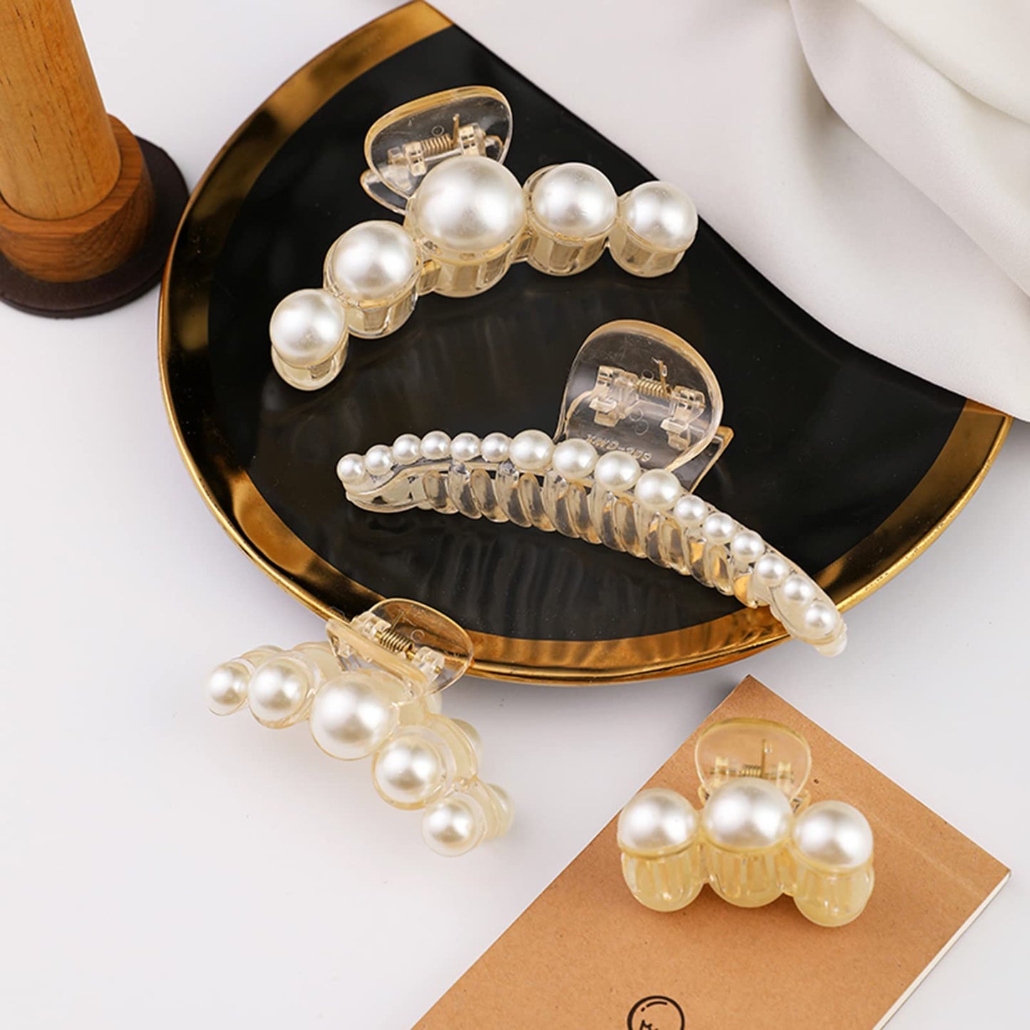 Elegant pearl hair clamps being used for a elegant wedding hairstyle look