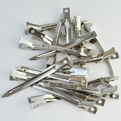 Side profile view showing the thin and sturdy design of the metal alligator clip
