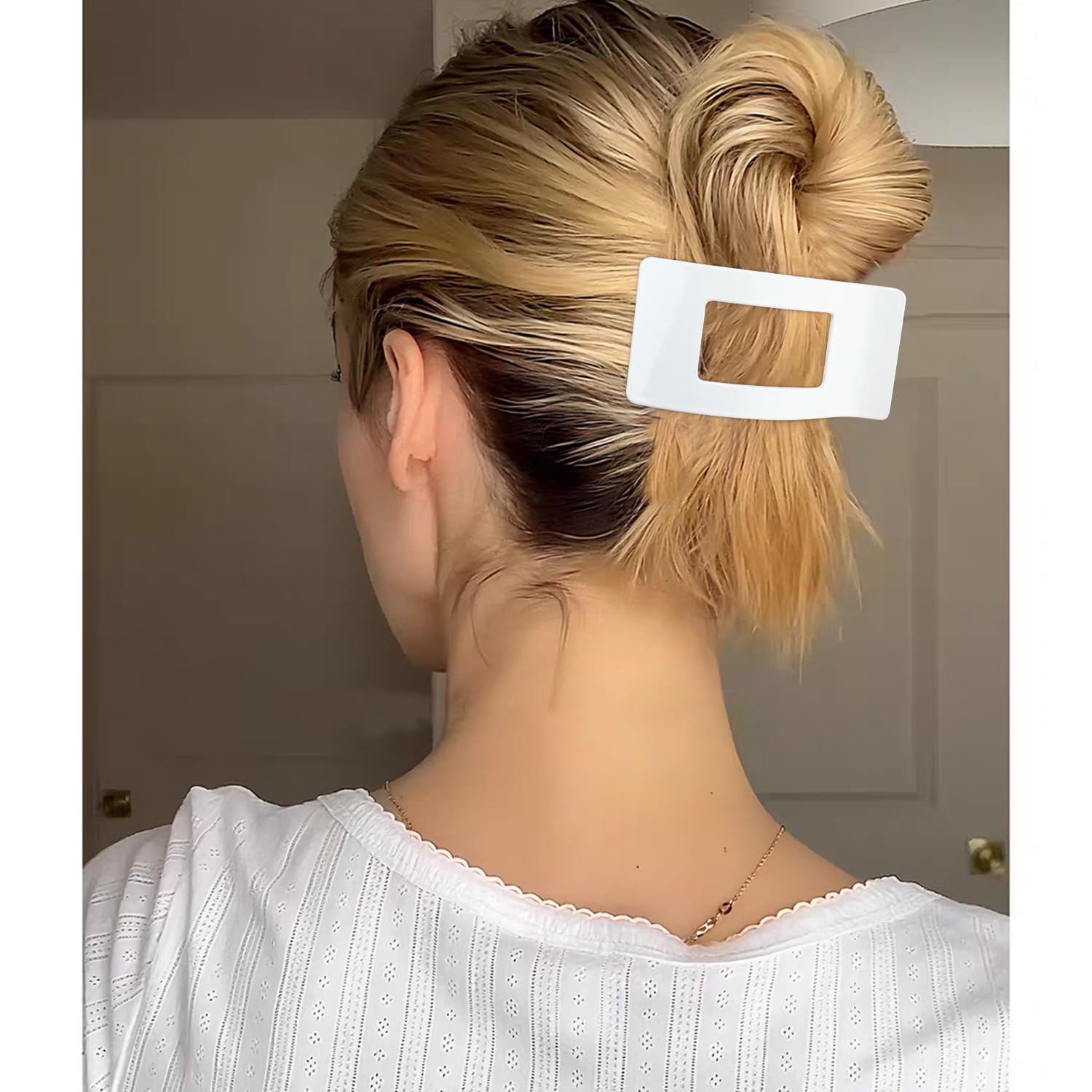 Velscrun hair clips held in hand for size reference