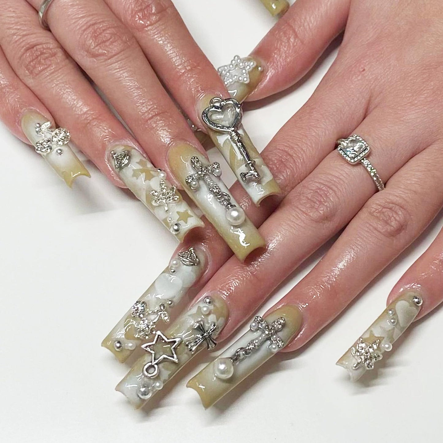 Assorted silver 3D nail gems for DIY manicures