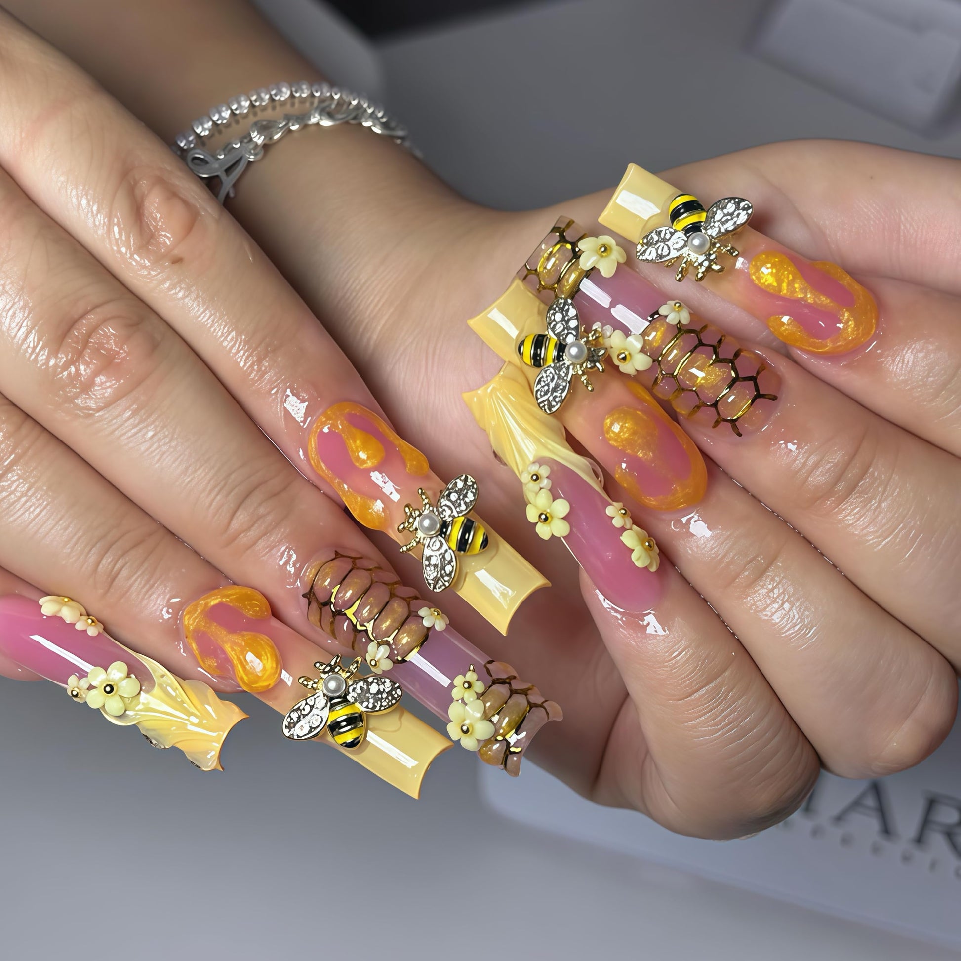 Application demonstration of BHCCXZ nail gems on acrylic nails