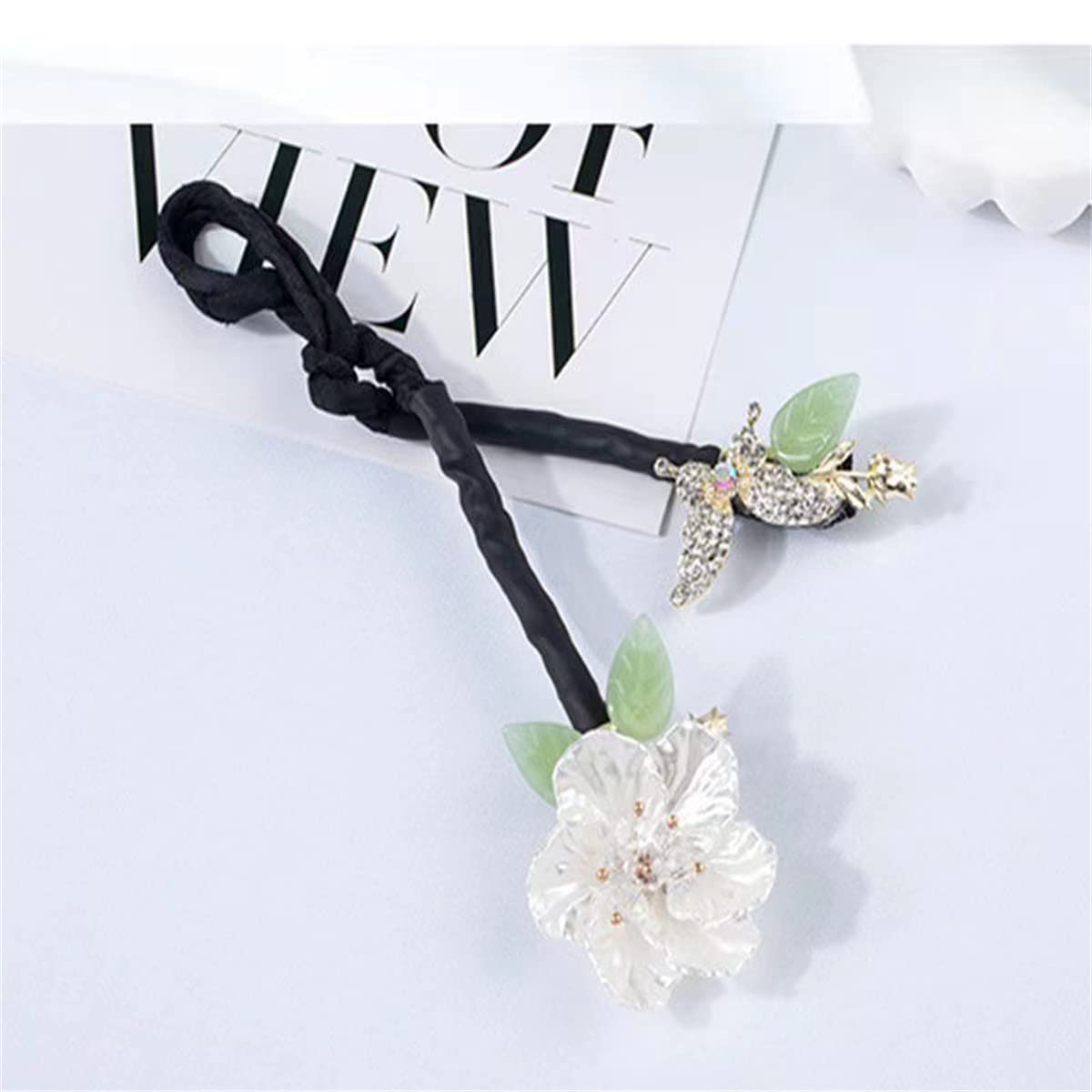 Takeberny rhinestone flower hair clip showing the bendable non slip fabric mechanism