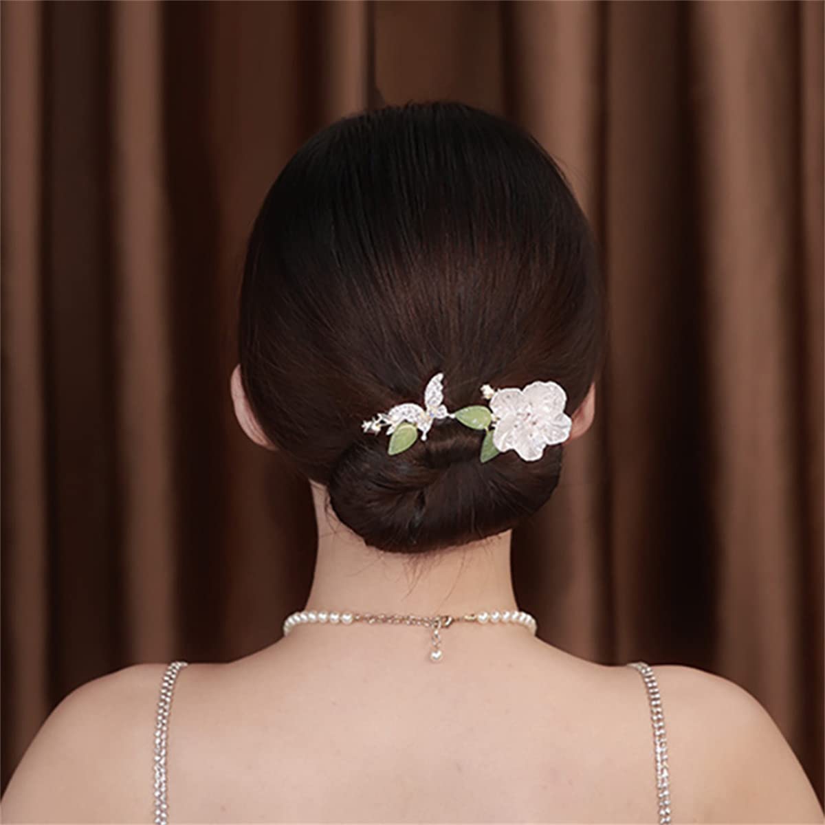 Takeberny Ins style floral hair bun accessory on a long thick hairstyle