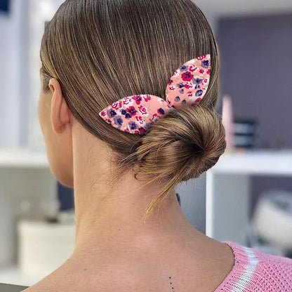 Step by step demonstration of a French twist hairstyle being created using the lazy hair band.