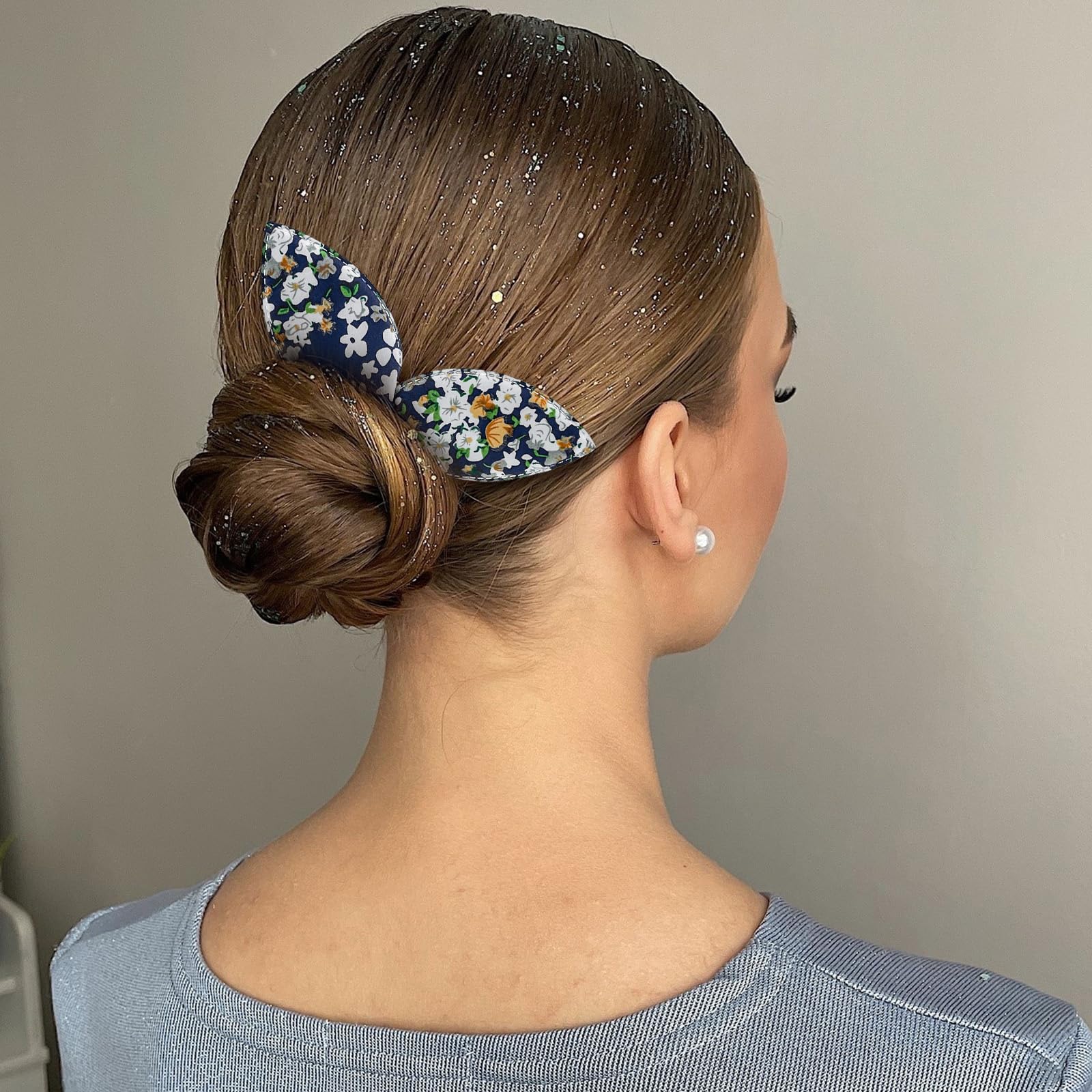 Four count set of non slip floral hair bun shapers laid out flat.