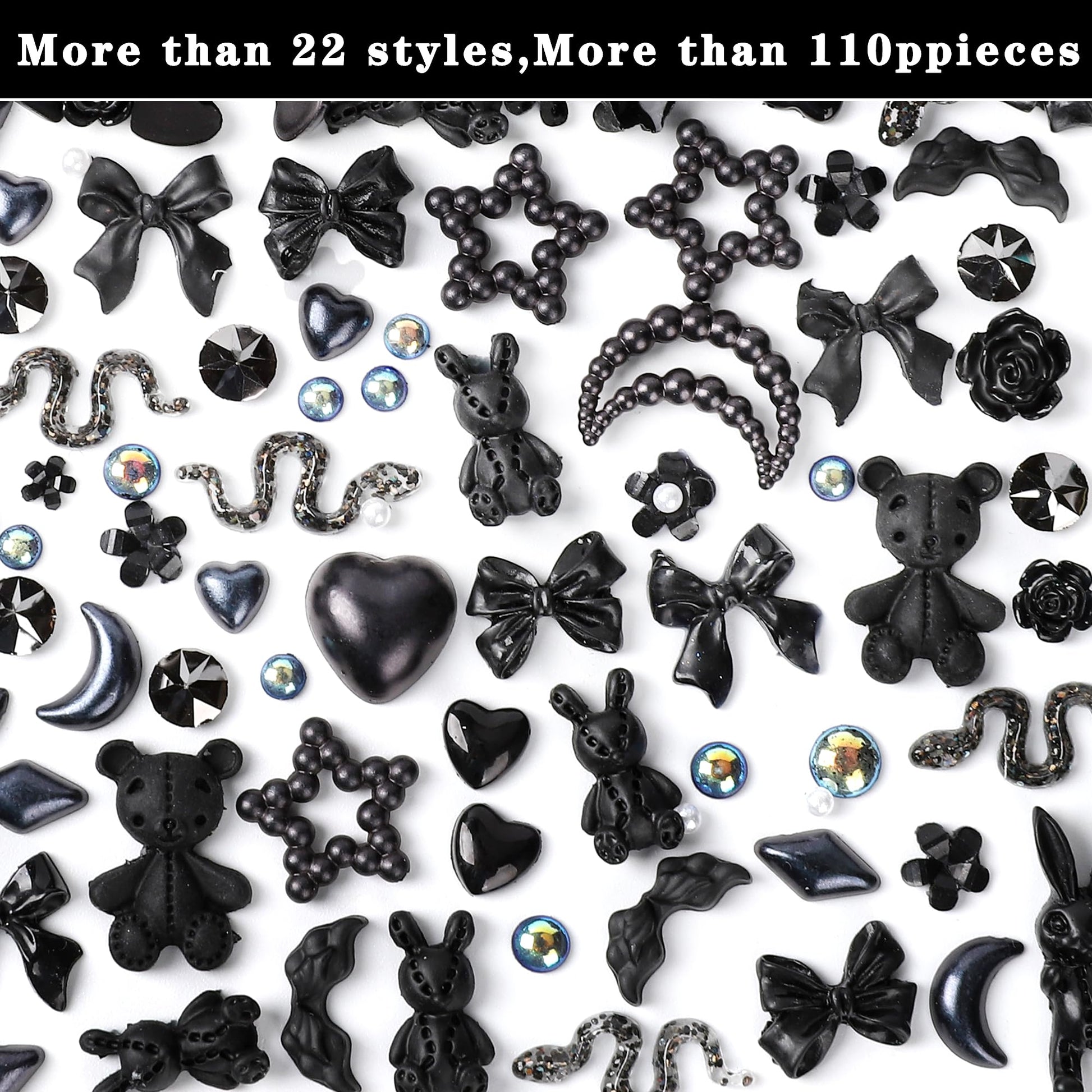 Detailed view of black resin flatback camellia rose and bowknot accessories for acrylic manicure decoration