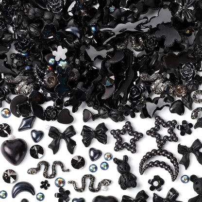 Collection of black themed DIY craft embellishments highlighting detailed textures of moons and roses