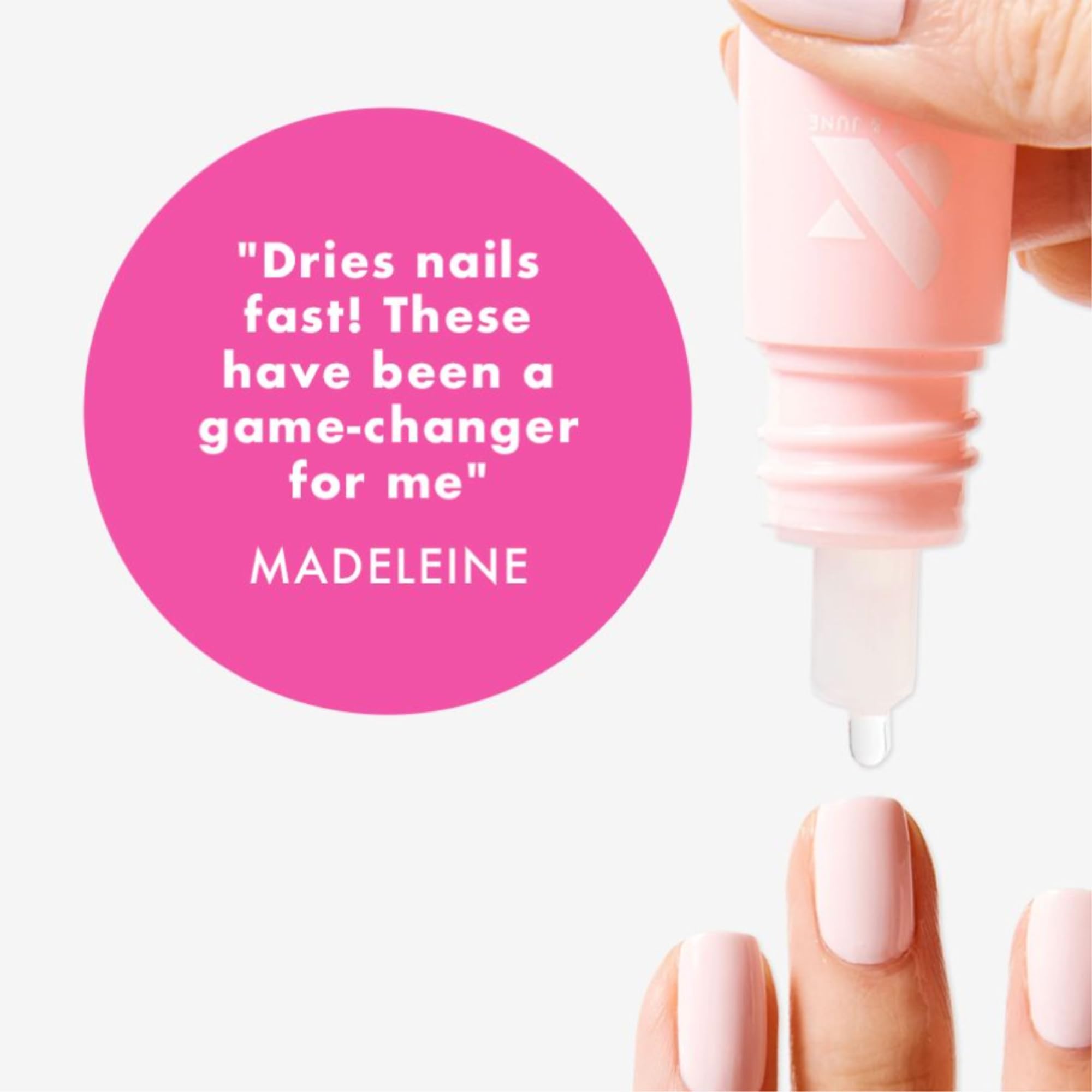 Hand applying Olive and June Dry Drops to polished nails.