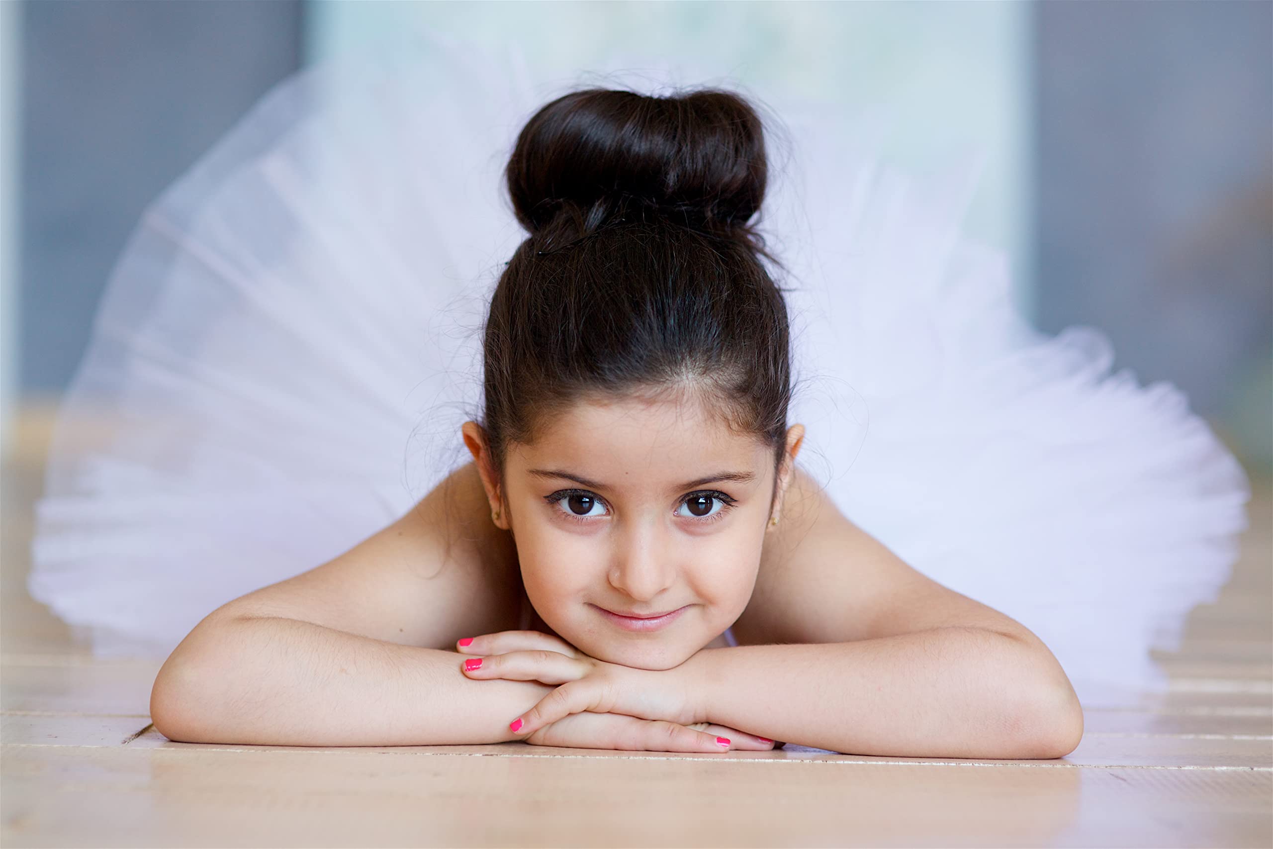 Six pieces of extra small children sock bun makers arranged neatly on a solid background