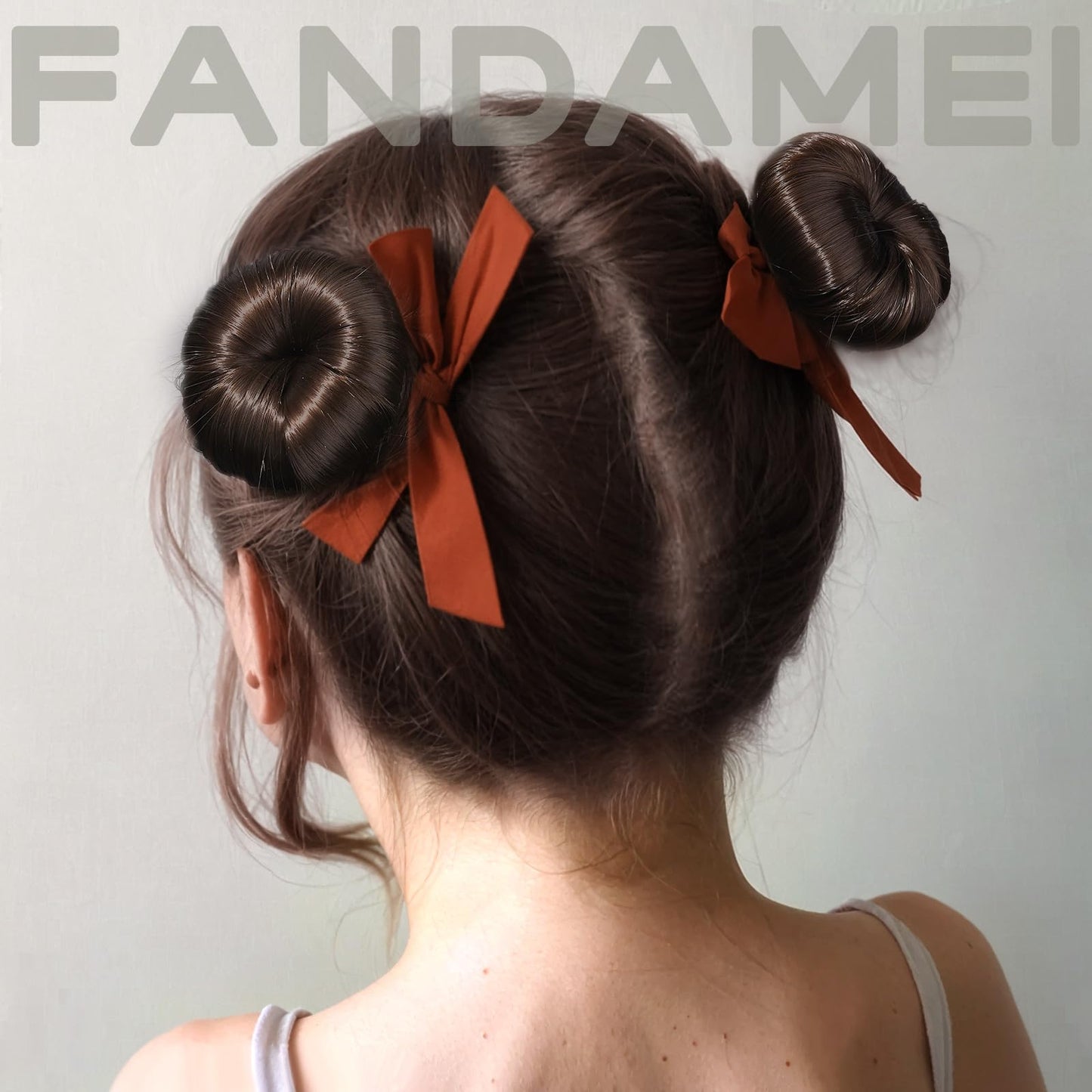 Fandamei hair bun kit for dancers containing forty pieces of brown metal hair pins