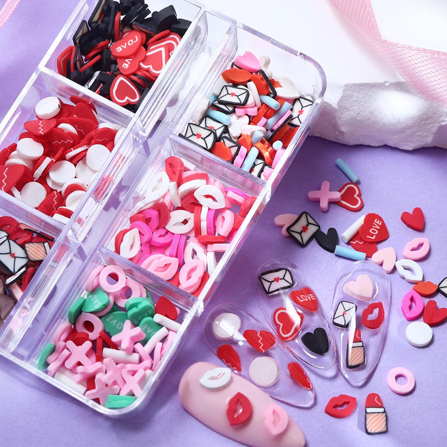 Tyuimhx valentine theme clay slices applied onto long acrylic nails as a design demonstration