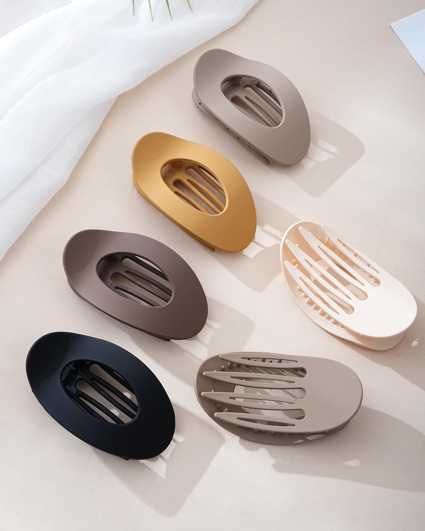 Assorted colors of Mesovor flat hair claw clips in packaging