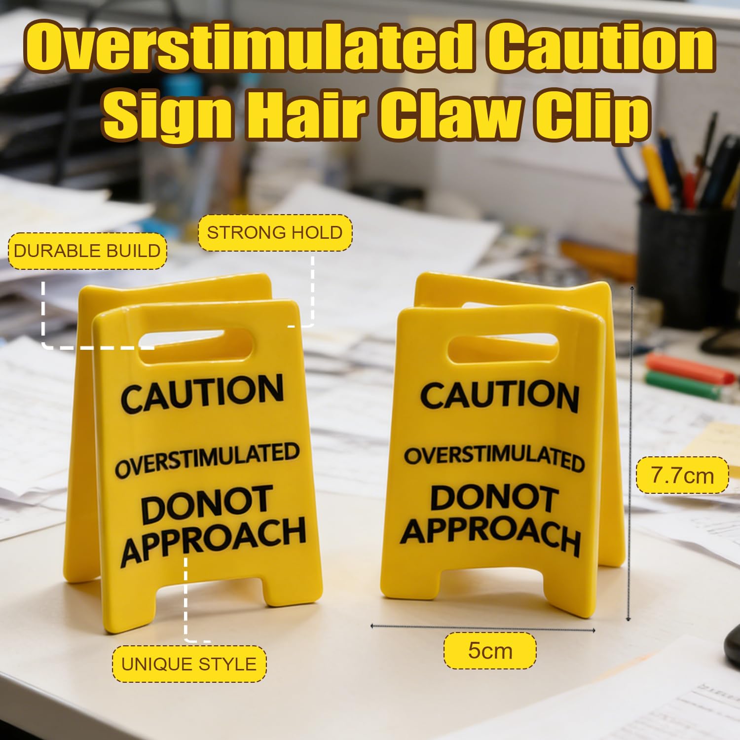 Quirky yellow statement claw clip placed on a flat surface displaying the bold black text clearly.