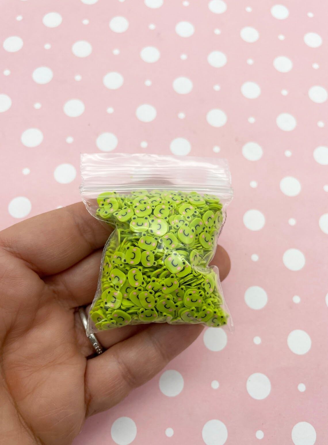 Handcrafted slime decorated with chartreuse frog fimo slices