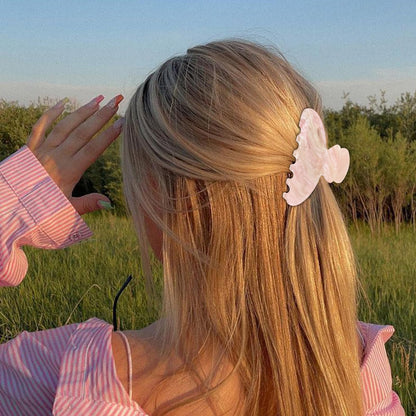 Side profile of glossy acrylic hair accessory