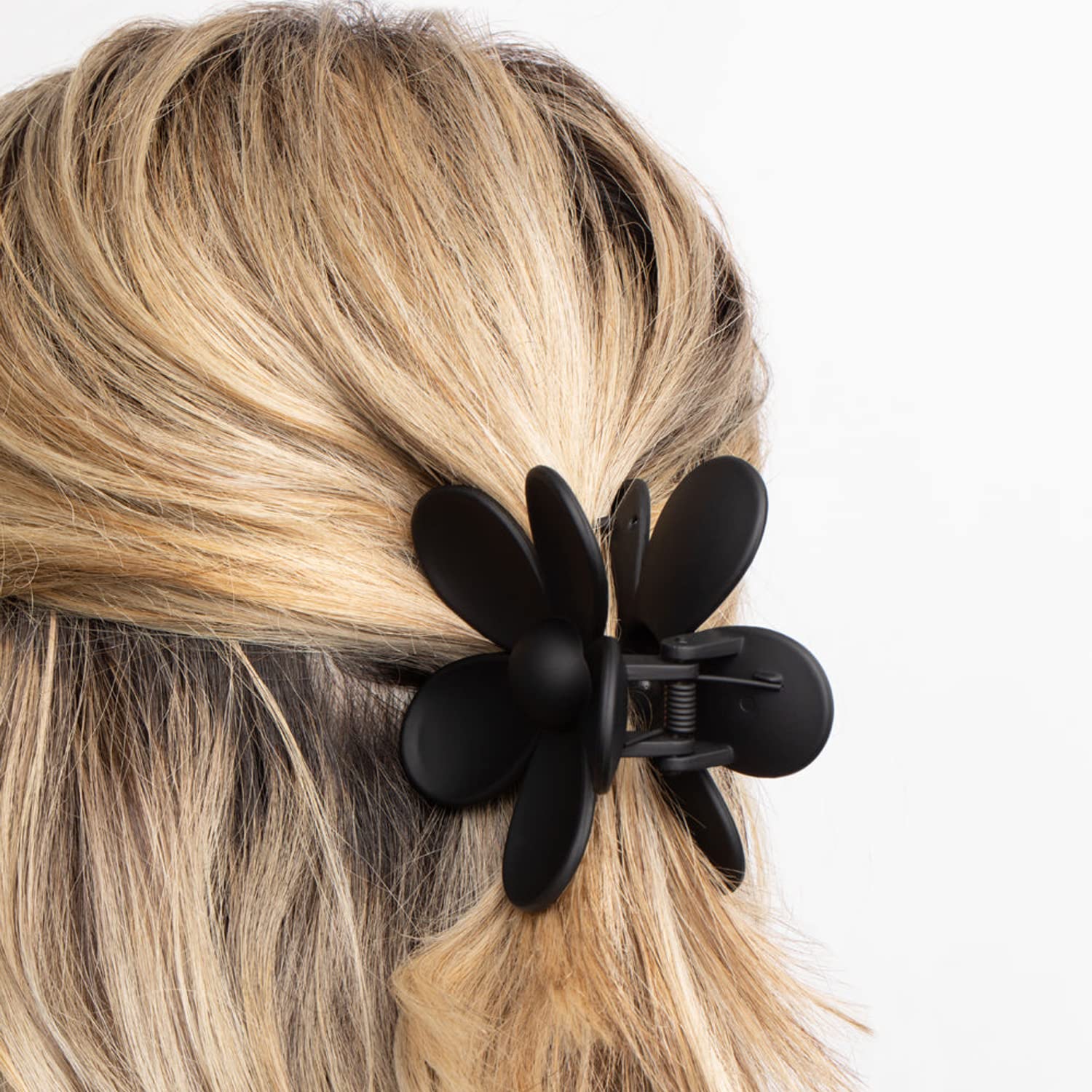 Side profile of large flower hair clip for thick hair