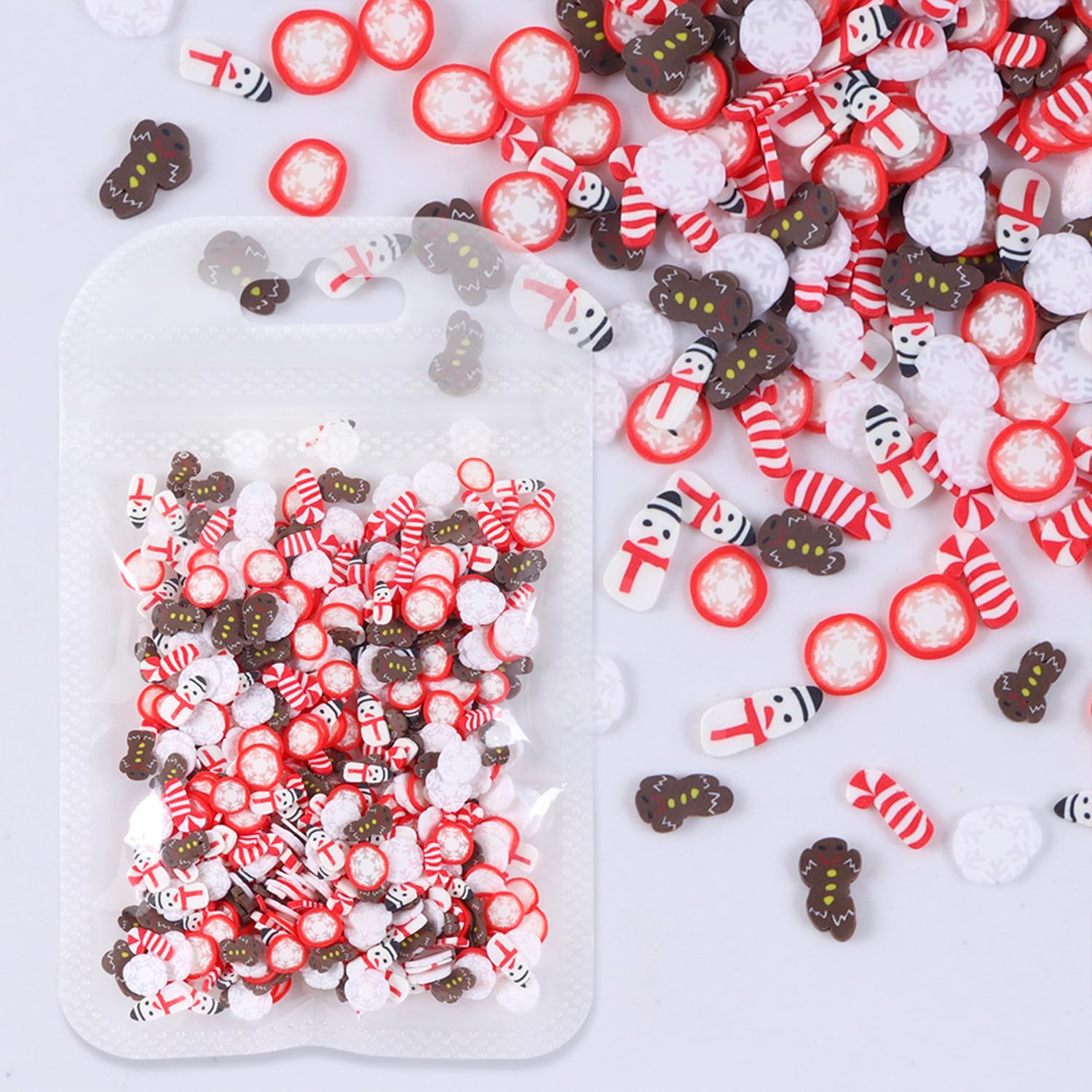 Assorted Christmas holiday nail design elements in containers