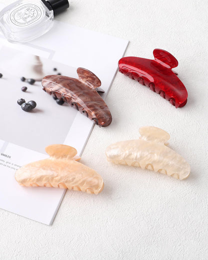 Assorted colors of Sanas large acrylic banana hair clips