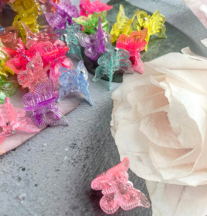 Bebeepoo glitter butterfly clips displayed in plastic container