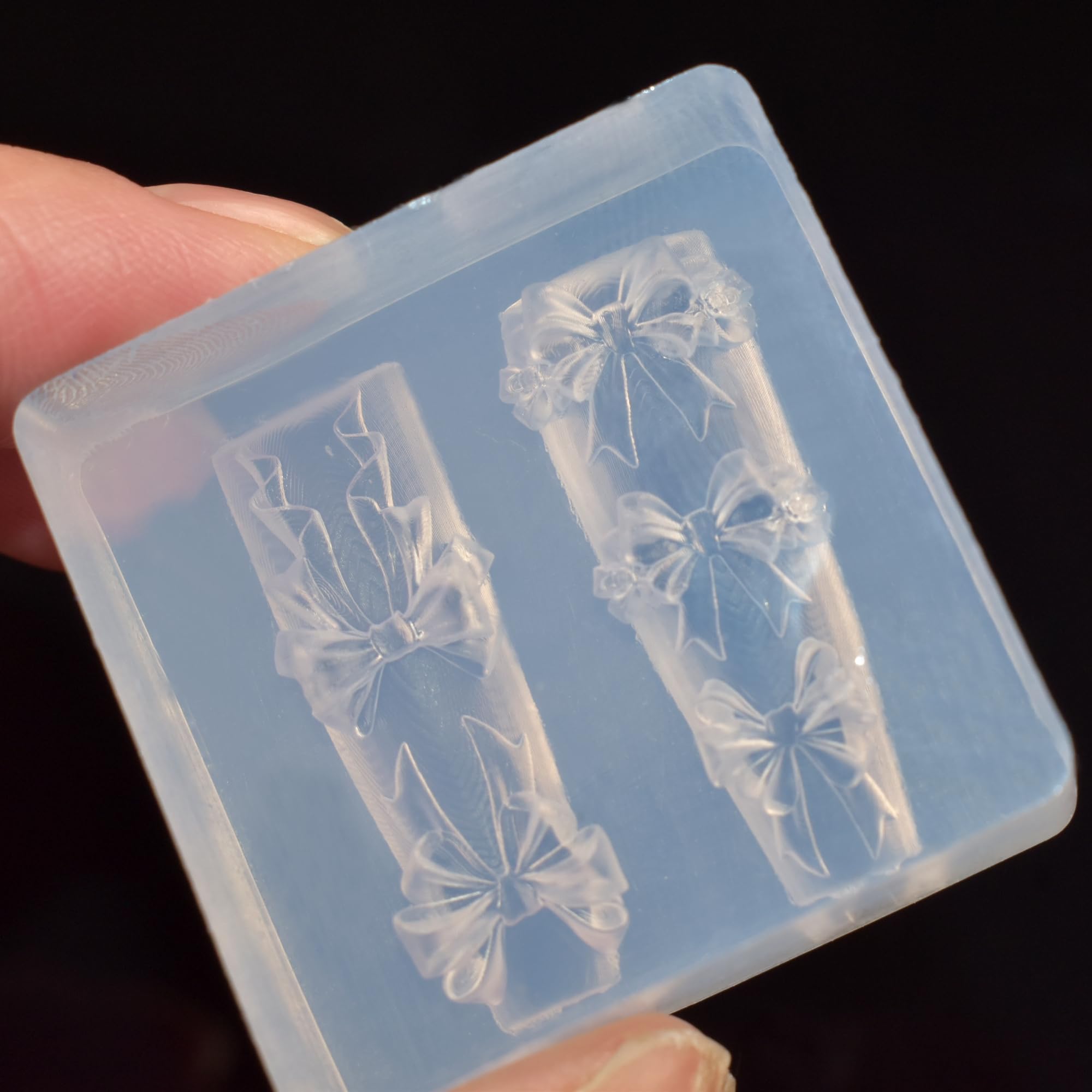 Close up of butterfly nail art mold cavities