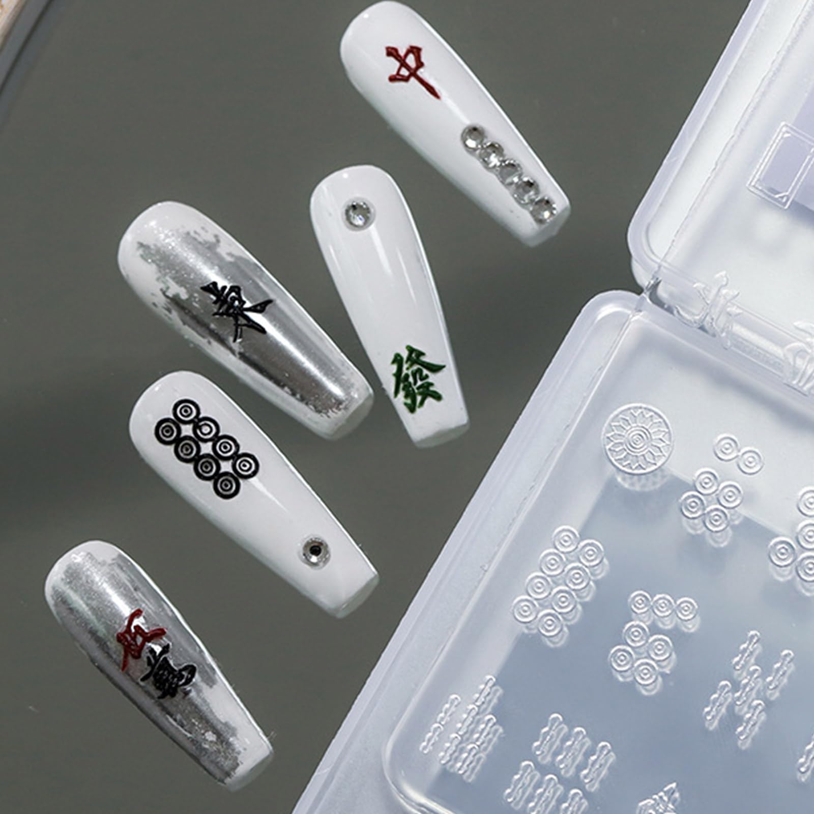 Handheld view of butterfly charm released from silicone mold