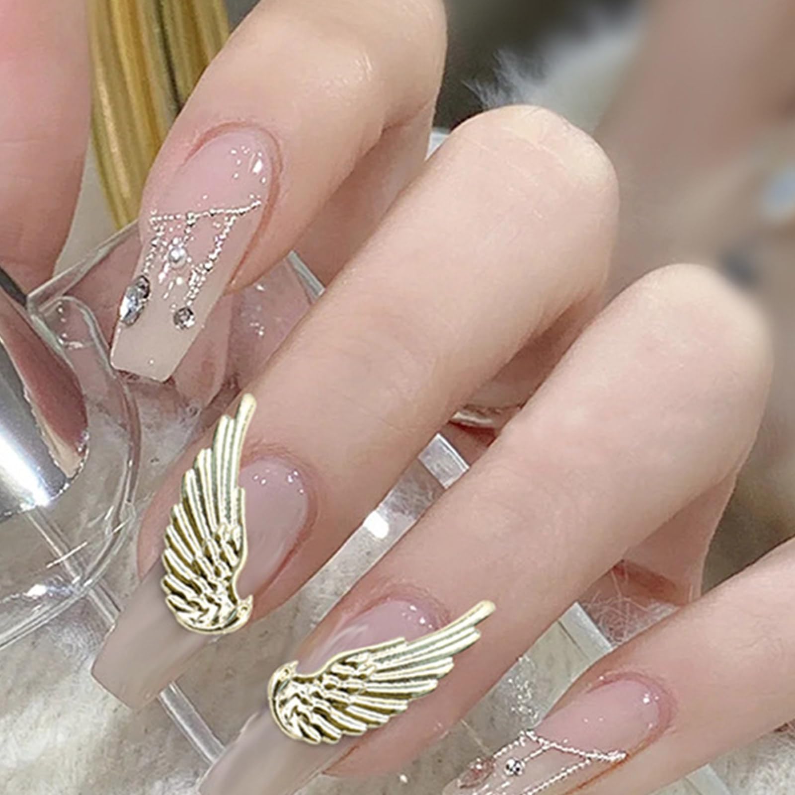 Close up of intricate wing patterns on DIY nail accessory mold