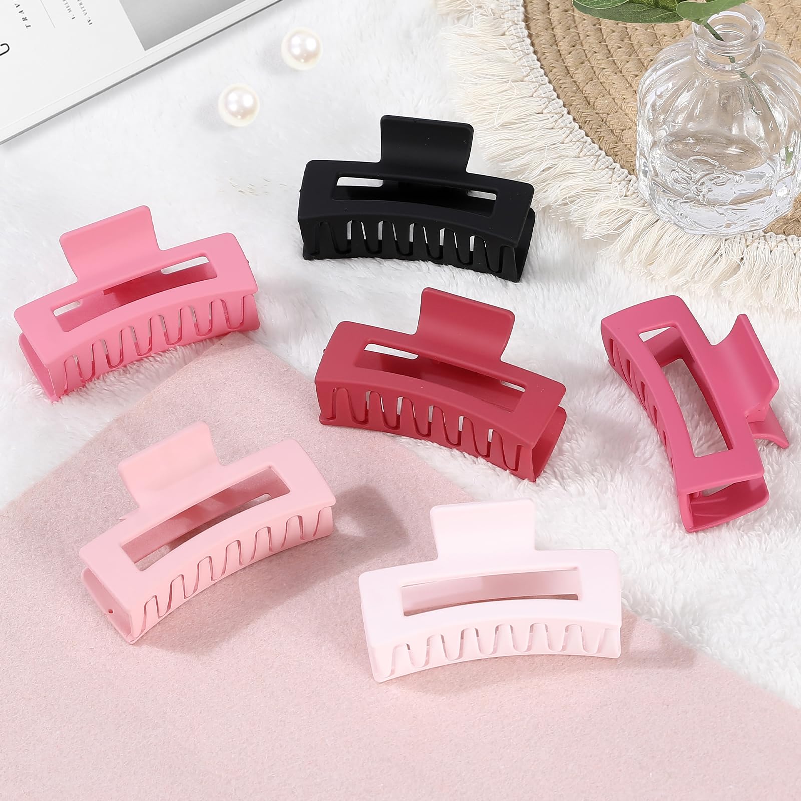 Set of 6 pink matte square hair claw clips arranged together