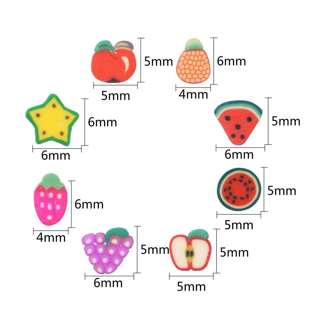 Close up view of assorted miniature polymer clay fruit shapes including strawberry watermelon and lemon designs