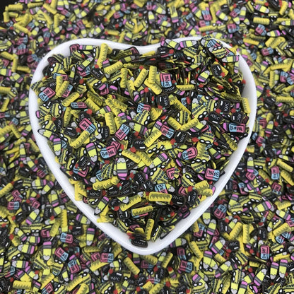 PrettyG Fimo soft clay sprinkles spread out on a flat surface demonstrating the variety of blackboard and ruler shapes.