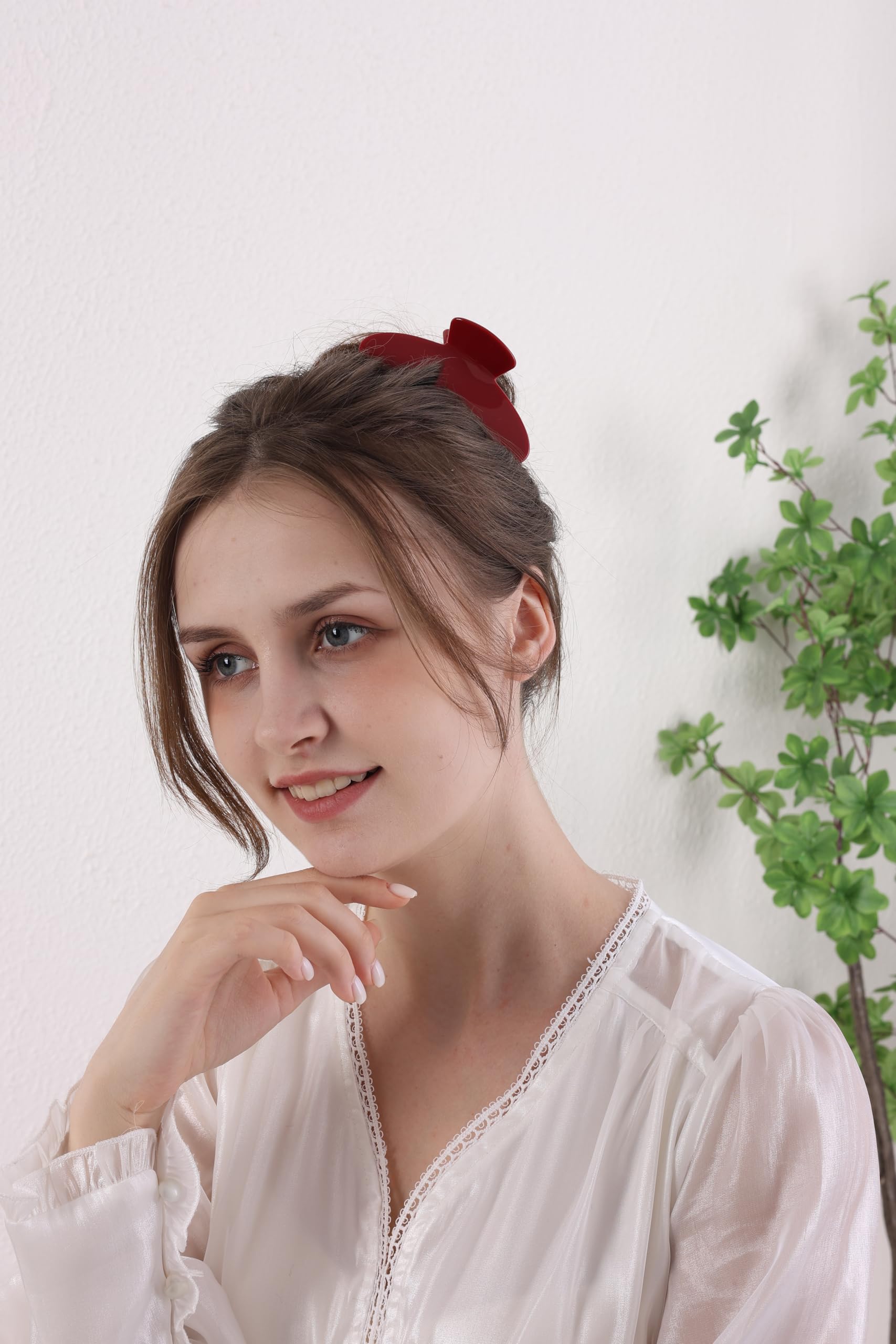 Cherry red acetate hair clip demonstrating secure grip