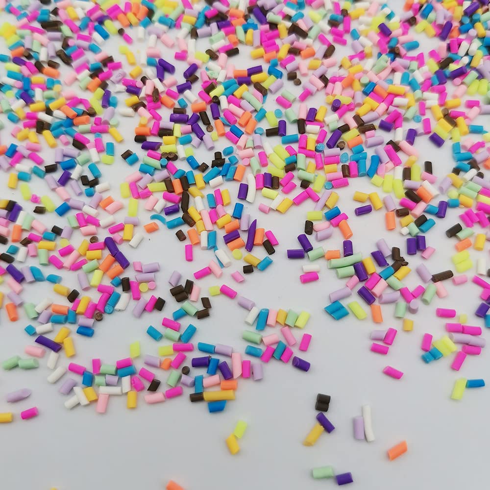 Vibrant polymer clay faux candy slices scattered on a flat surface