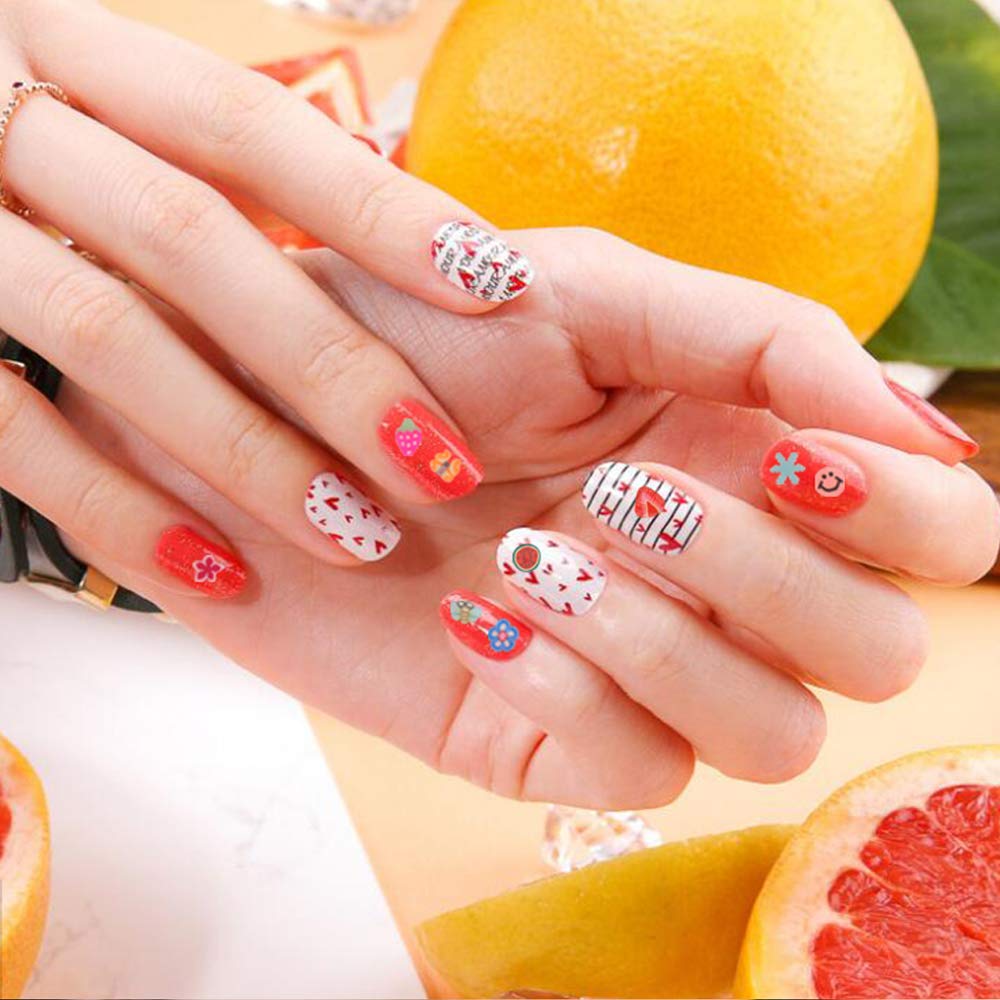 Manicure showcase featuring colorful miniature fruit slices embedded under a glossy gel topcoat