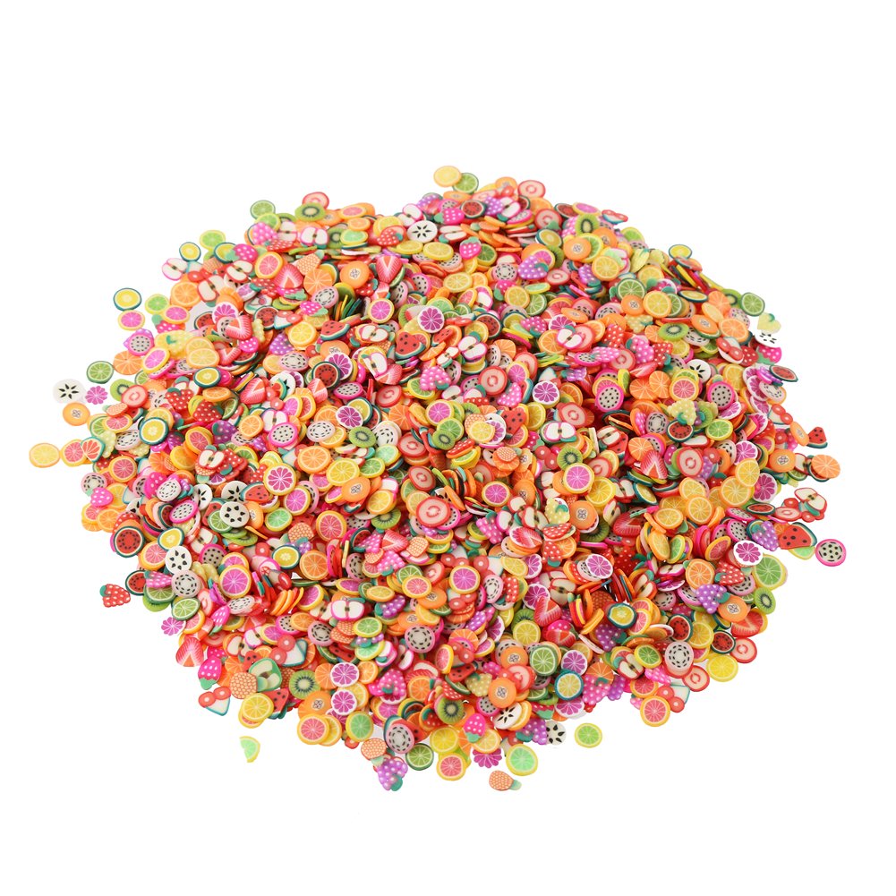 Miniature fimo clay fruit slices spread out to show thin half millimeter pre cut texture