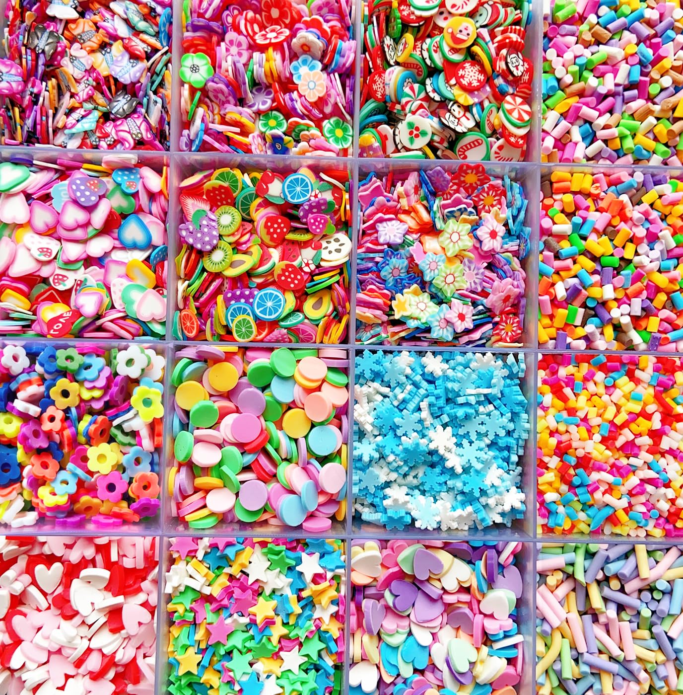 Vibrant miniature polymer clay fruit slices and resin candy sprinkles neatly organized in a clear divided storage container