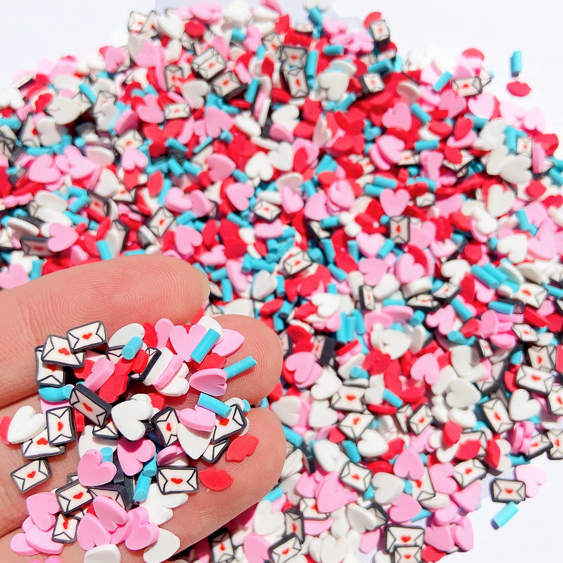 Close up look of pink and red polymer clay heart slices used for resin jewelry making