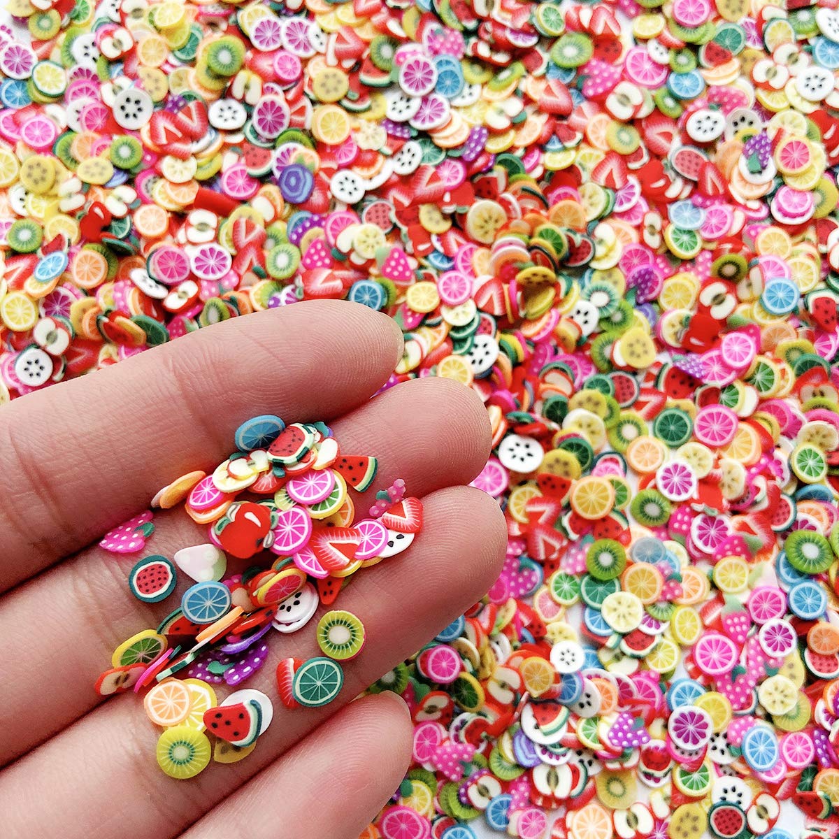 Close up view of assorted EHOPE 3D polymer clay slices for manicures and DIY slime charms.