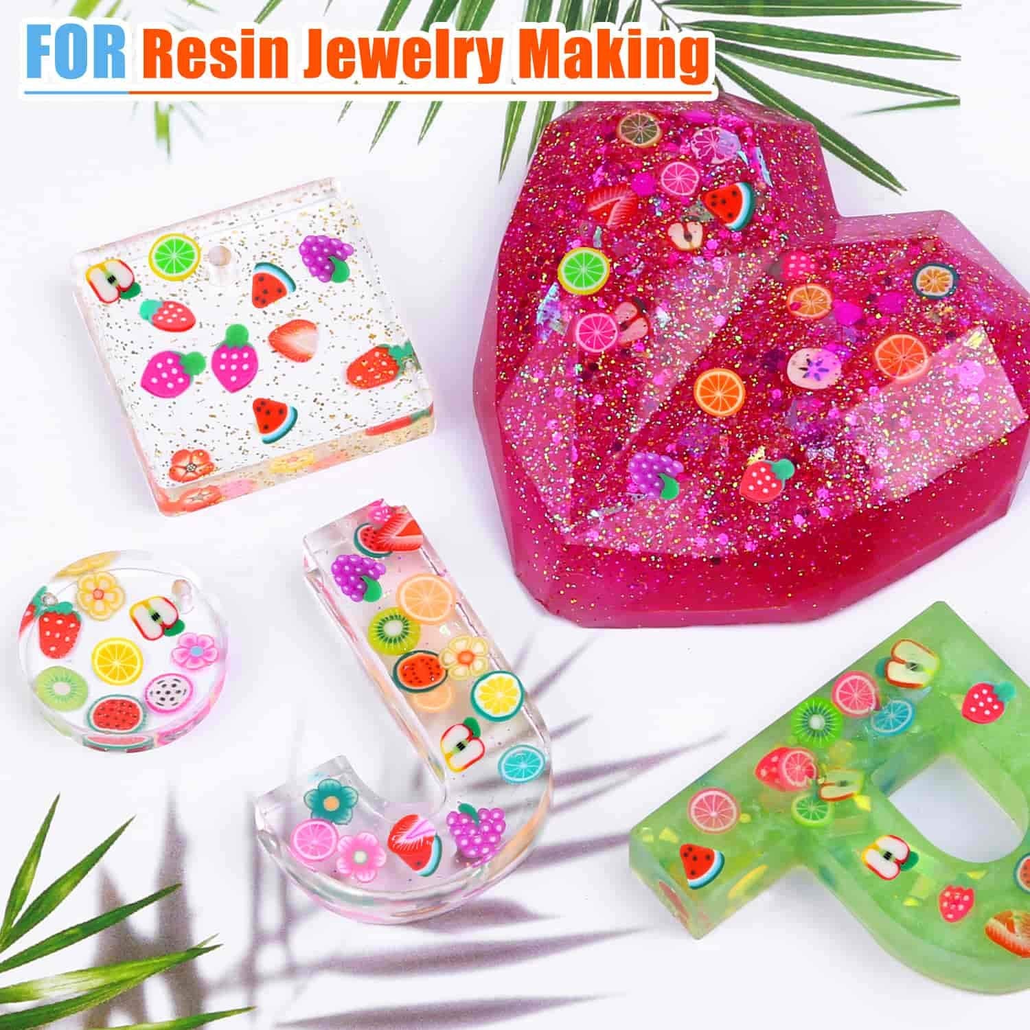 Colorful polymer clay miniature fruit discs being embedded into clear epoxy resin jewelry molds.