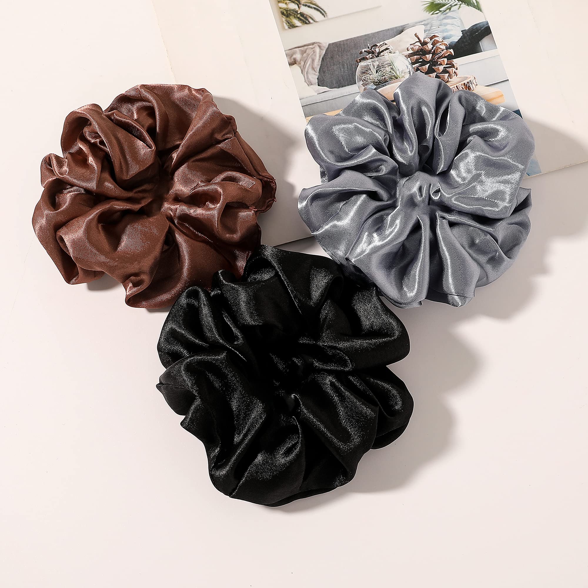 Ivyu neutral satin scrunchies being worn comfortably around a wrist.