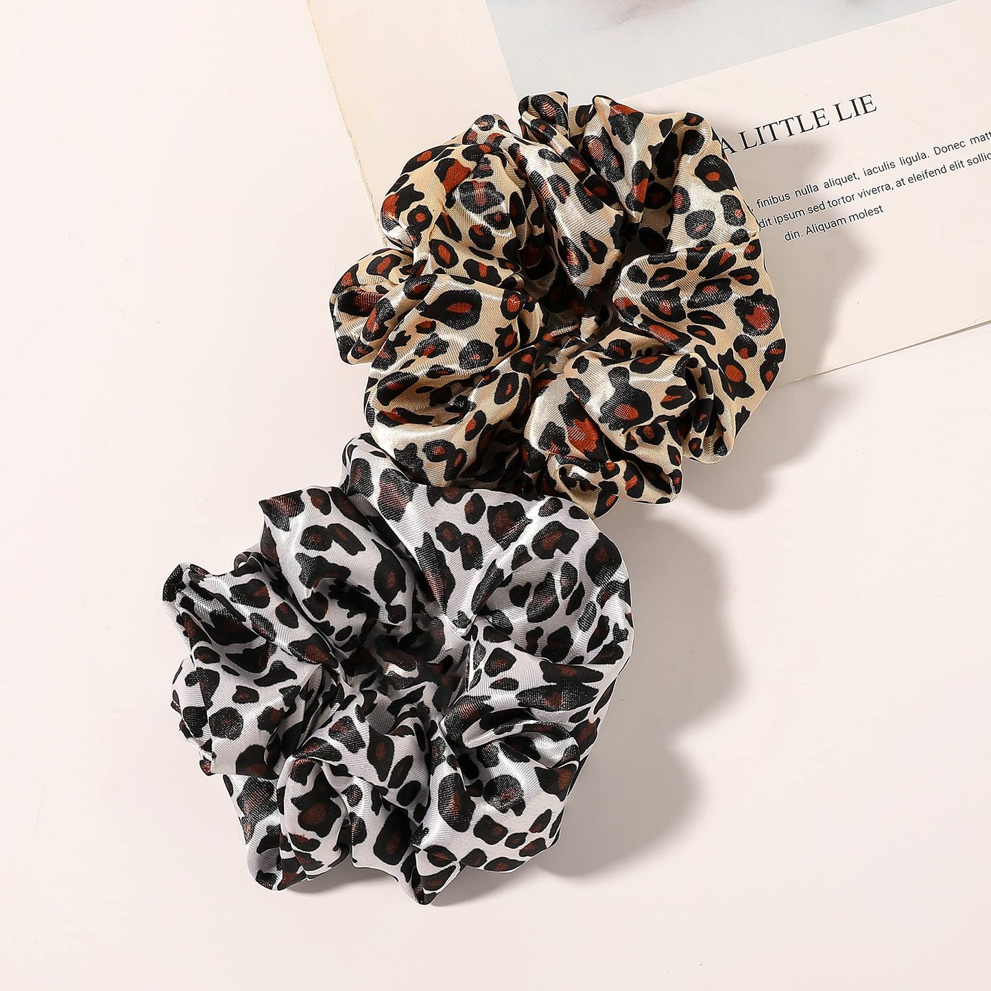 Different angles of the smooth texture on the Ivyu silk satin ponytail holder.