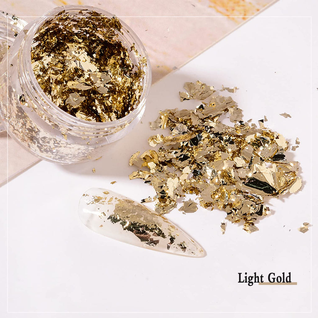 Craft supplies layout with metallic foil flakes for DIY projects