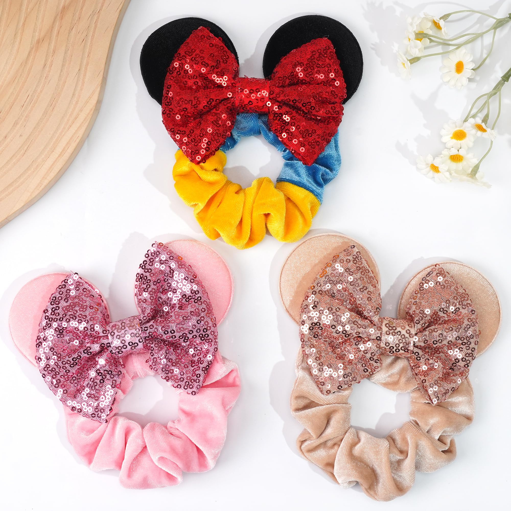 Six pack assortment of CellElection cartoon mouse ear elastic ponytail holders laid flat.