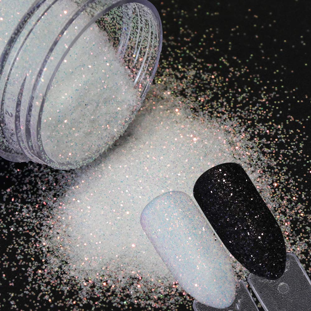 Professional nail technician applying shimmer dust to nails