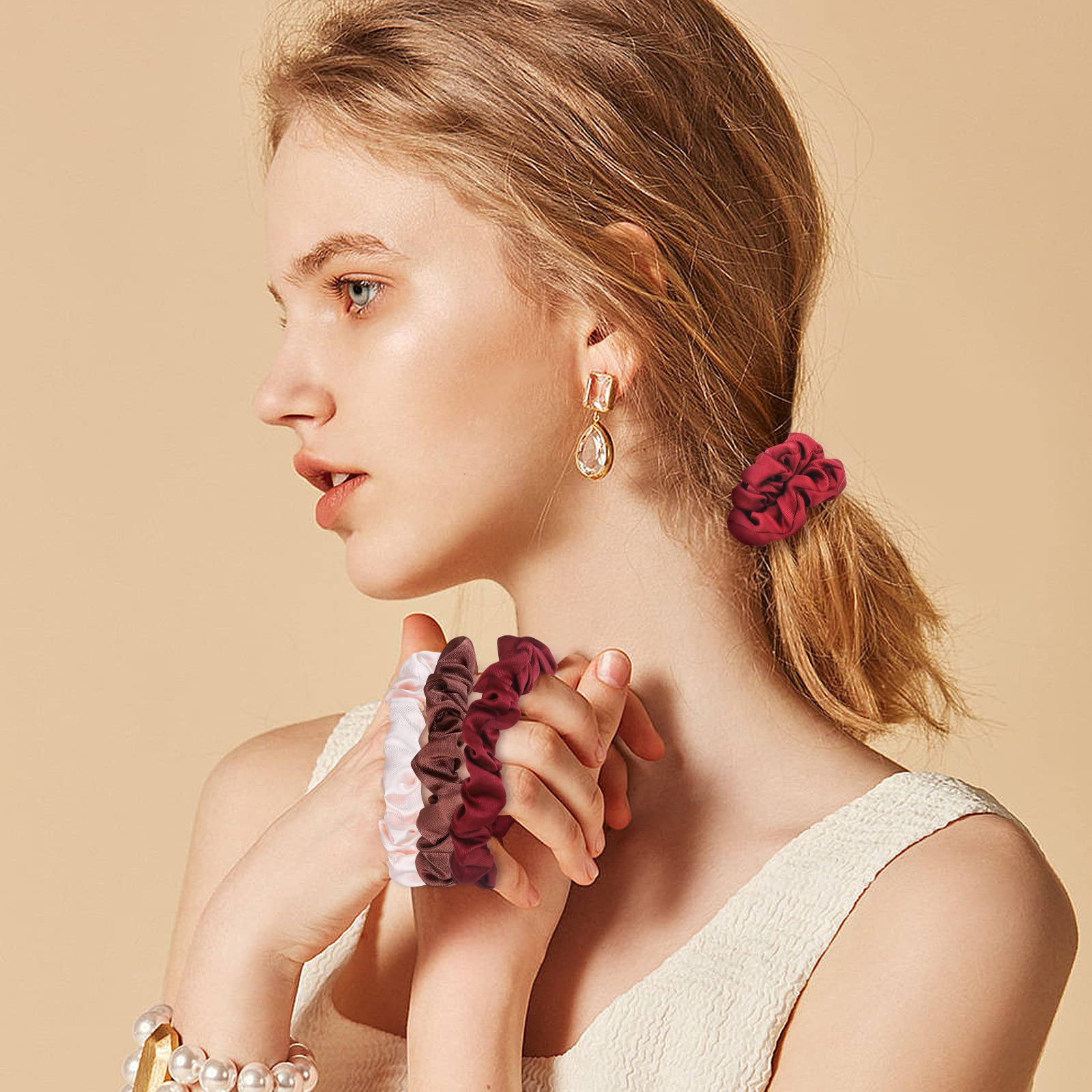 Soft premium satin ponytail holders worn on the wrist