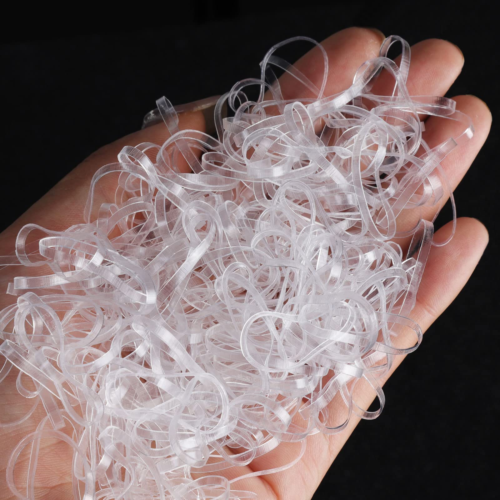 Teenitor transparent rubber bands for hair styling being used to secure a neat braid