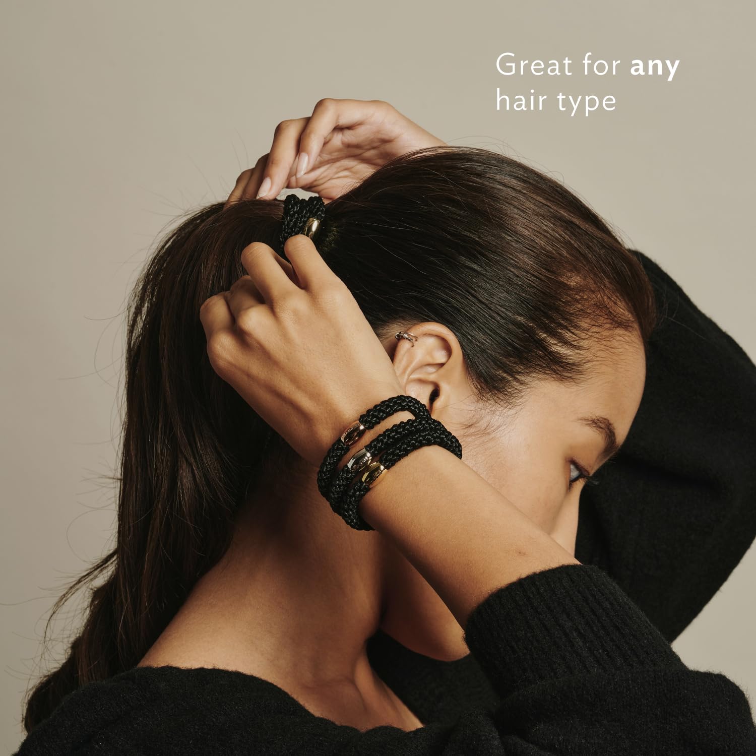 L. Erickson non damaging black hair bands styled as a wrist bracelet.