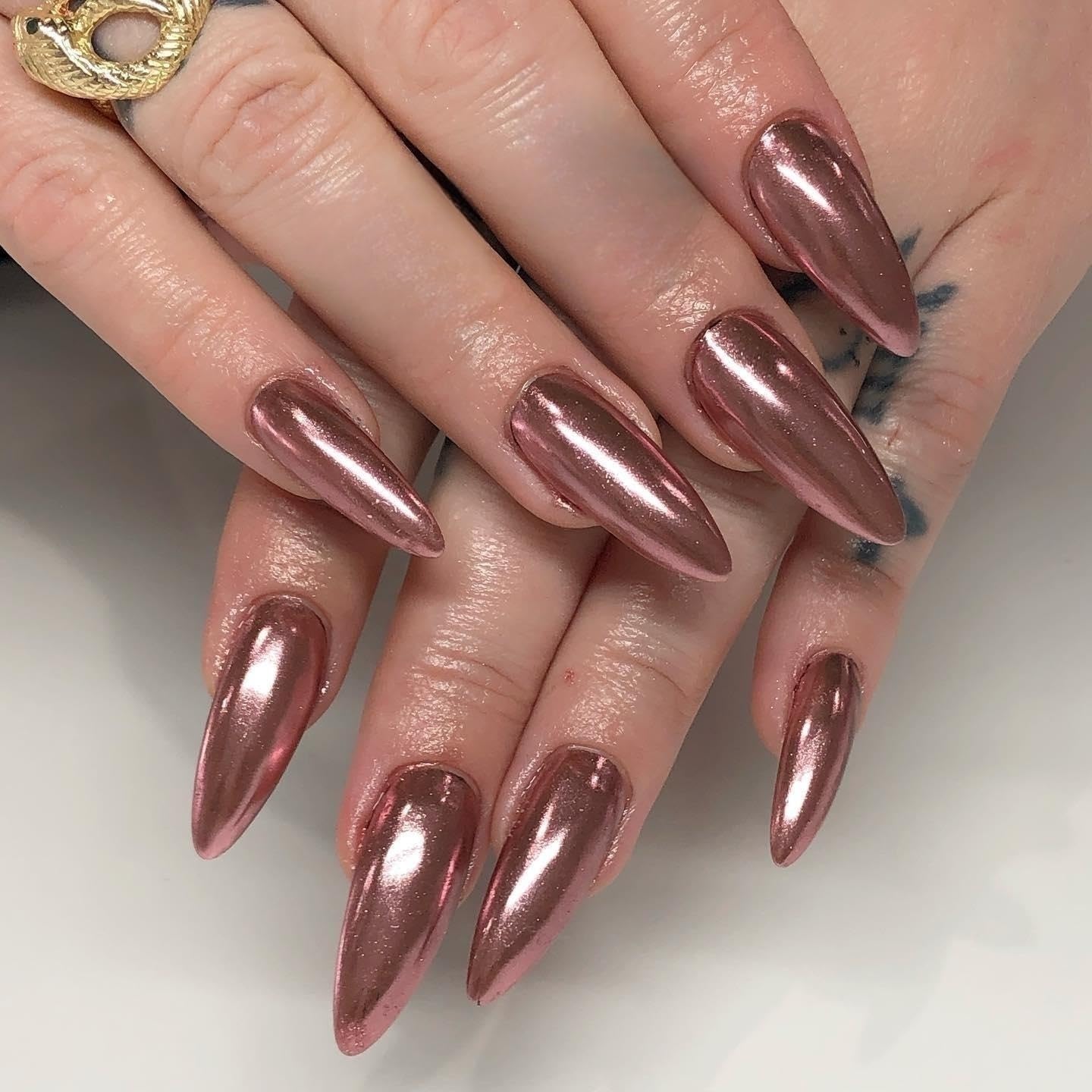 Close up of rose gold chrome pigment texture