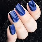 Gel polish nail art design featuring royal blue metallic finish