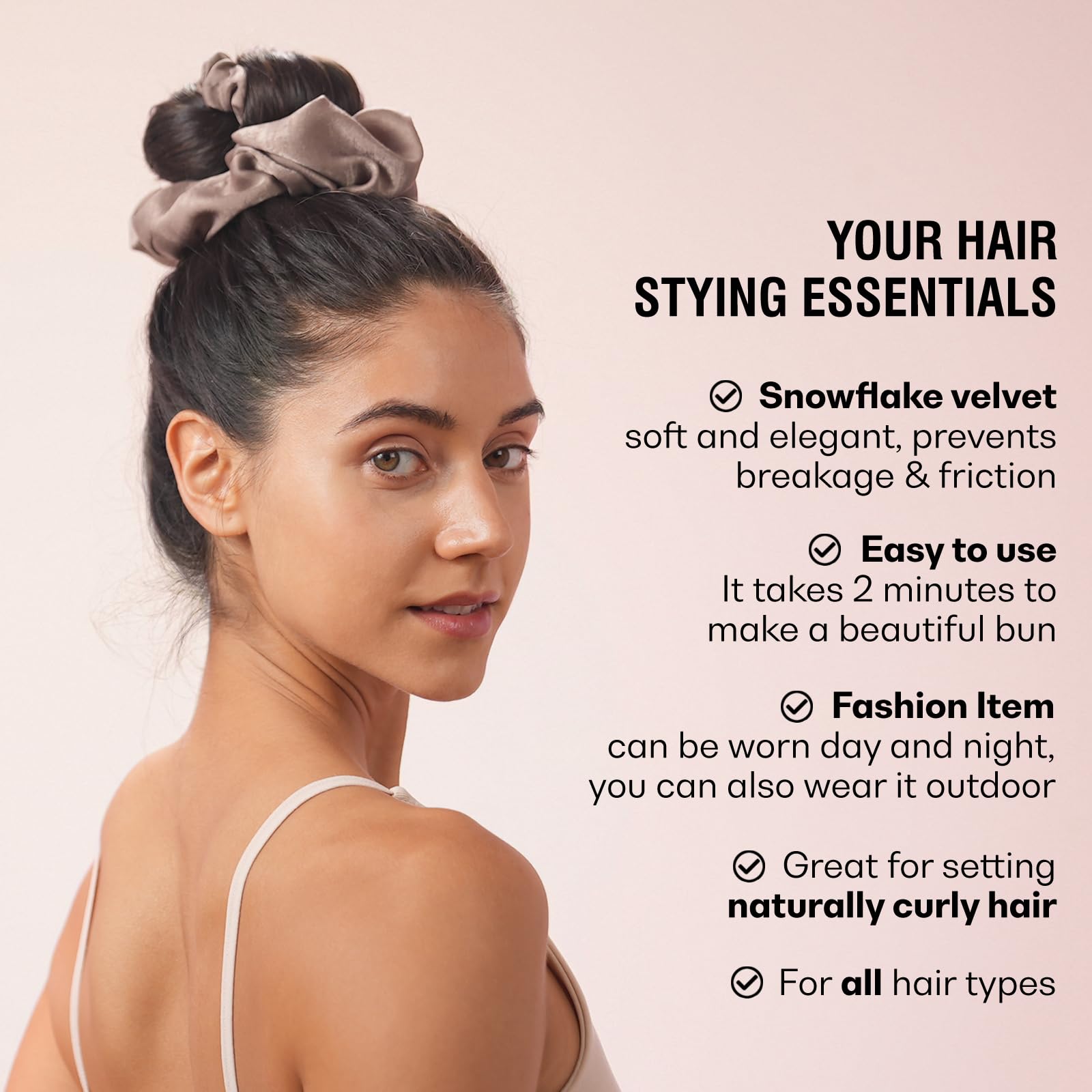 Model showing voluminous heatless curls achieved using the black scrunchie tie
